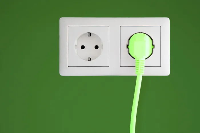 Framed Print : Power Socket with Green Plug Print