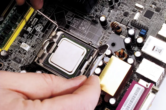 Framed Print : Processor Chip Being Built into a Motherboard Print