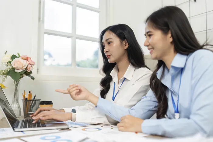 Framed Print : Two Professionals Focused on a Laptop Print Framed Print : Two Professionals Focused on a Laptop Print