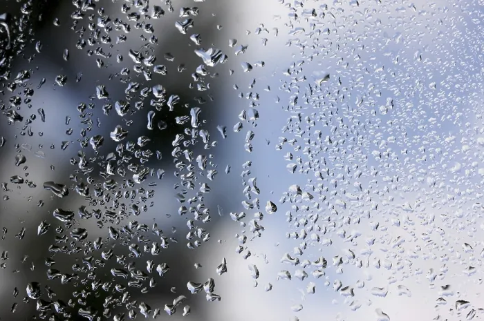 Framed Print : Rain Drops on Window as Clouds Clear Behind - Print Framed Print : Rain Drops on Window as Clouds Clear Behind - Print