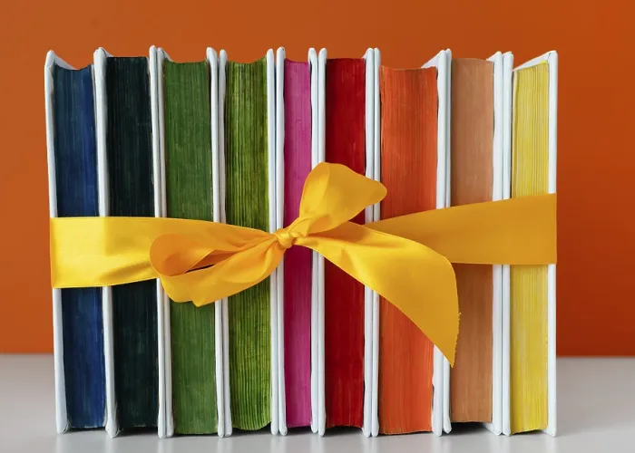 Framed Print : Print of Rainbow Books Stack with Yellow Ribbon Framed Print : Print of Rainbow Books Stack with Yellow Ribbon