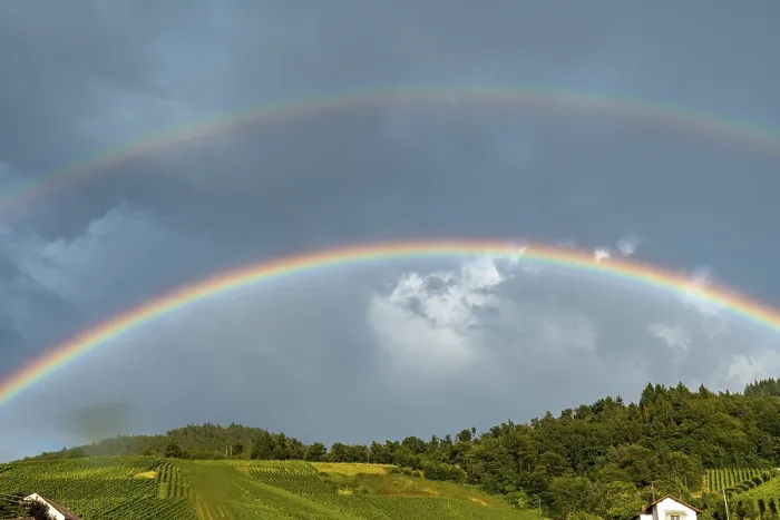 Framed Print : A Rainbow Above a Cloudy Hillside Print