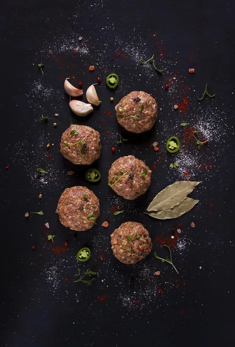 Framed Print : Raw Meatballs Print on Black Background Framed Print : Raw Meatballs Print on Black Background