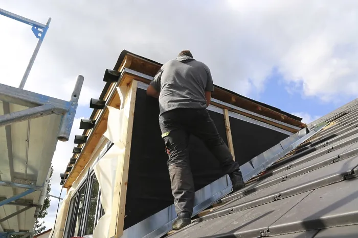 Framed Print : Roofer working on a new dormer window print Framed Print : Roofer working on a new dormer window print