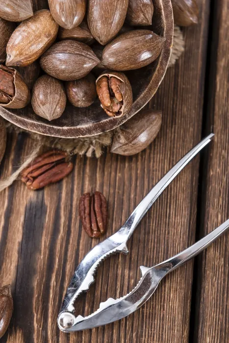 Framed Print : Rustic Wooden Table with Pecan Nuts Print Framed Print : Rustic Wooden Table with Pecan Nuts Print
