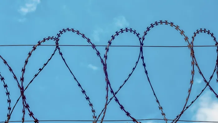 Framed Print : Rusty Barbed Wire Print on Blue Sky Background Framed Print : Rusty Barbed Wire Print on Blue Sky Background