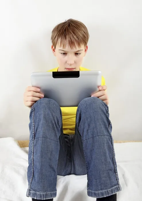 Framed Print : Sad Kid with Tablet Computer Print on White Background Framed Print : Sad Kid with Tablet Computer Print on White Background