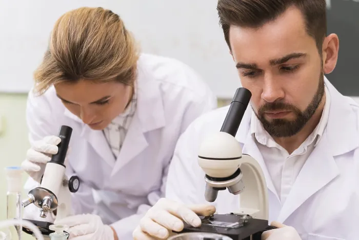 Framed Print : Scientist Colleagues Using Microscopes in Laboratory Print Framed Print : Scientist Colleagues Using Microscopes in Laboratory Print