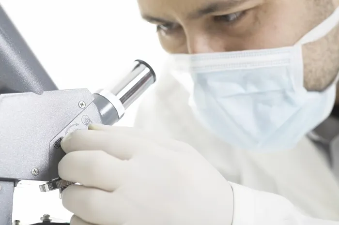 Framed Print : Scientist Watches through a Microscope Print Framed Print : Scientist Watches through a Microscope Print