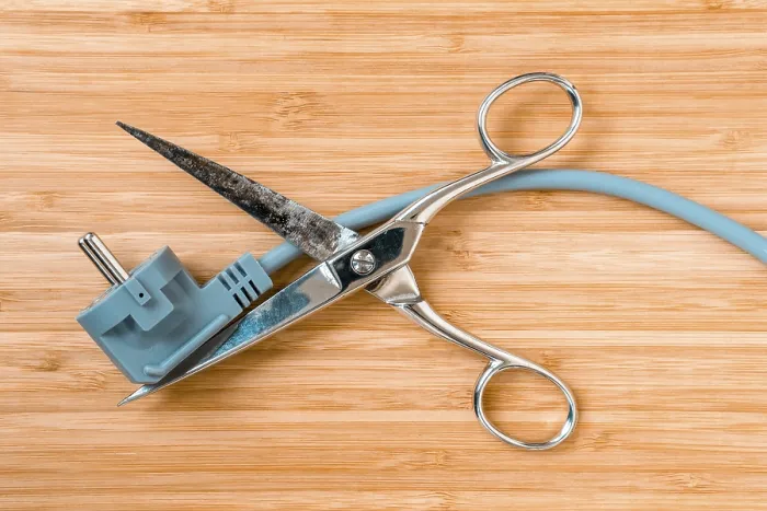 Framed Print : Scissors Cutting Electric Wire Print - Energy Saving Concept Framed Print : Scissors Cutting Electric Wire Print - Energy Saving Concept