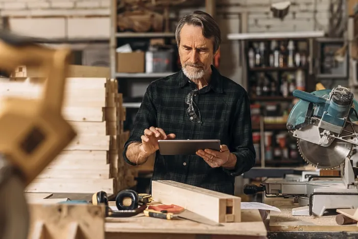 Framed Print : Senior Carpenter Using a Digital Tablet Print Framed Print : Senior Carpenter Using a Digital Tablet Print