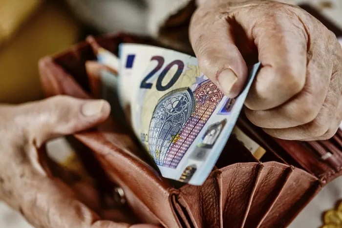 Framed Print : Senior Citizen Pulls 20 Euro Note from Wallet Print, Germany Framed Print : Senior Citizen Pulls 20 Euro Note from Wallet Print, Germany