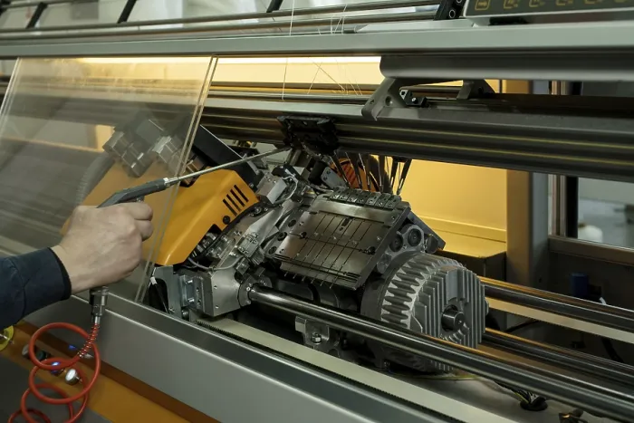 Framed Print : Serviceman Setting Up Knitting Machine Print Framed Print : Serviceman Setting Up Knitting Machine Print