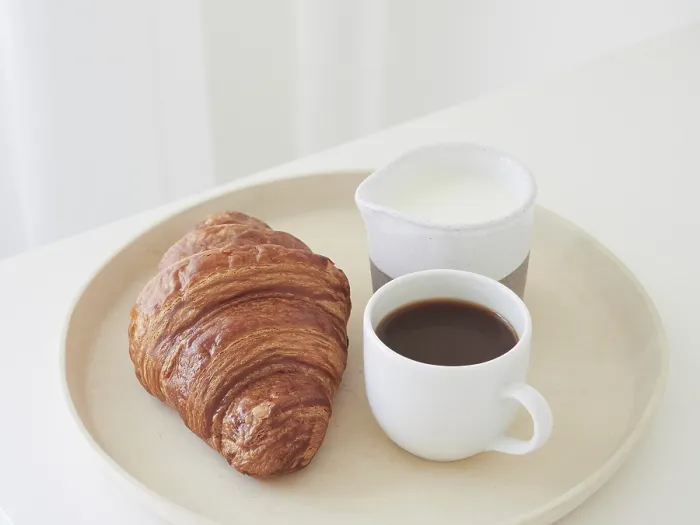 Framed Print : Simple Breakfast Print: Croissant and Coffee on White Table Framed Print : Simple Breakfast Print: Croissant and Coffee on White Table