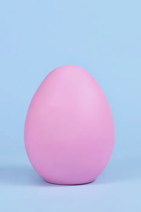 Framed Print : Single Pink Easter Egg on Blue Background Print Framed Print : Single Pink Easter Egg on Blue Background Print