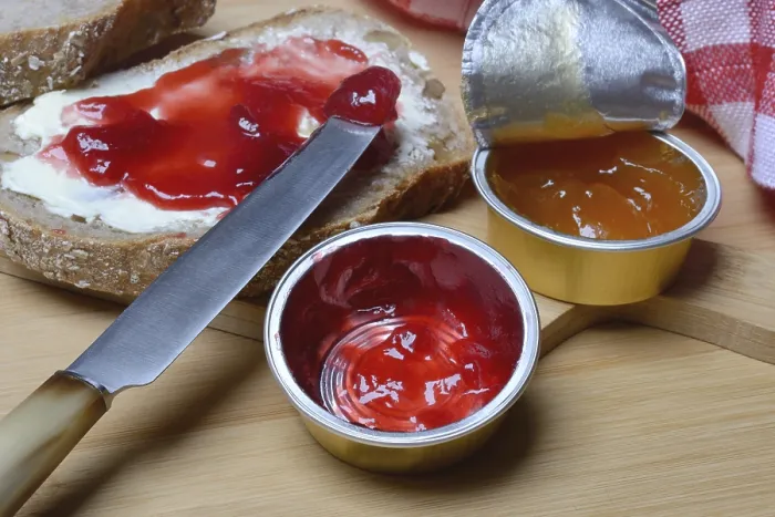 Framed Print : Slice of bread with jam and jam in portion pack Print Framed Print : Slice of bread with jam and jam in portion pack Print