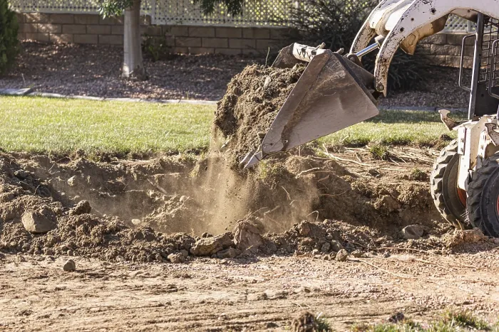 Framed Print : Small Bulldozer Digging in Yard for Pool Installation Print