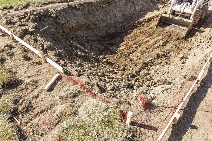 Framed Print : Small Bulldozer Digging in Yard Print