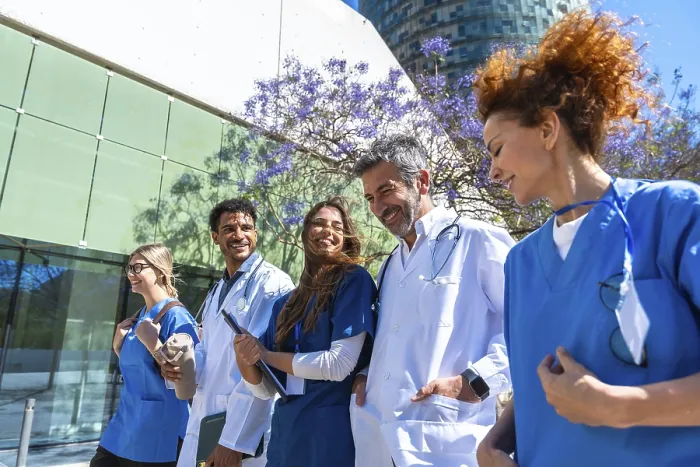 Framed Print : Smiling Doctors and Nurses Walking Outdoors Print Framed Print : Smiling Doctors and Nurses Walking Outdoors Print