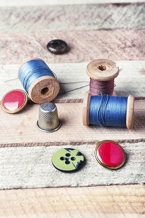 Framed Print : Spools of Thread and Buttons on Wooden Background Print Framed Print : Spools of Thread and Buttons on Wooden Background Print
