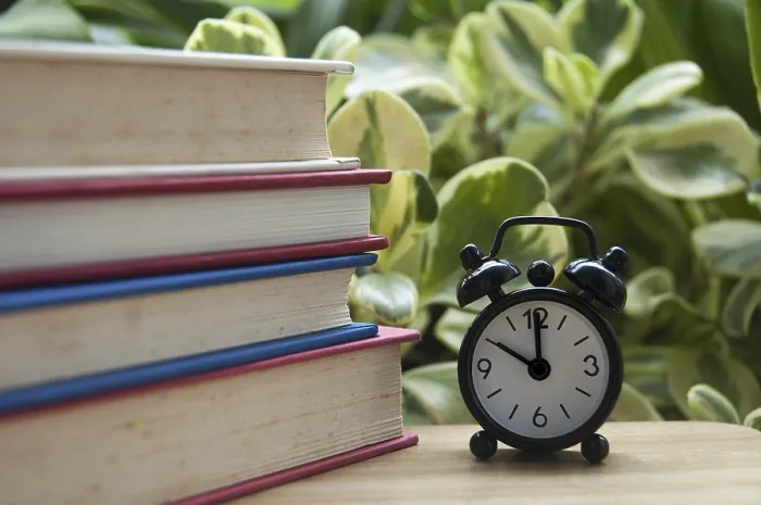 Framed Print : Stack of Books with Alarm Clock at 10 o'Clock Print Concept Framed Print : Stack of Books with Alarm Clock at 10 o'Clock Print Concept
