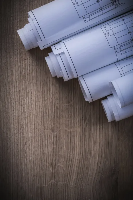 Framed Print : Stack of Rolled Blueprints Print on Wooden Background Framed Print : Stack of Rolled Blueprints Print on Wooden Background