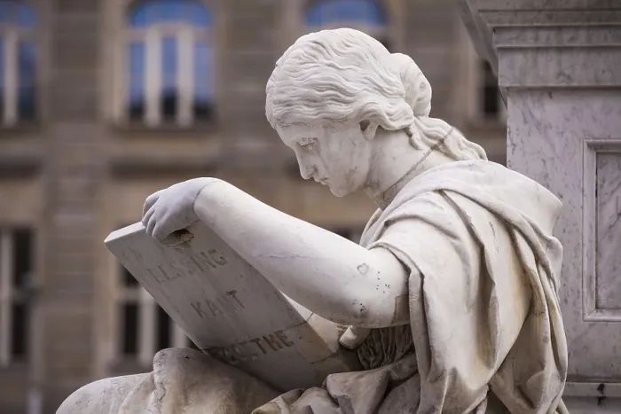 Framed Print : Statue of a reading scholar Print