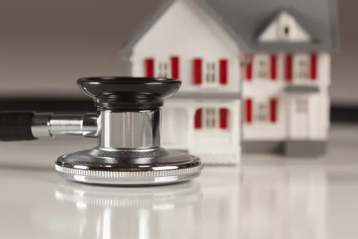 Framed Print : Stethoscope and model house Print Framed Print : Stethoscope and model house Print