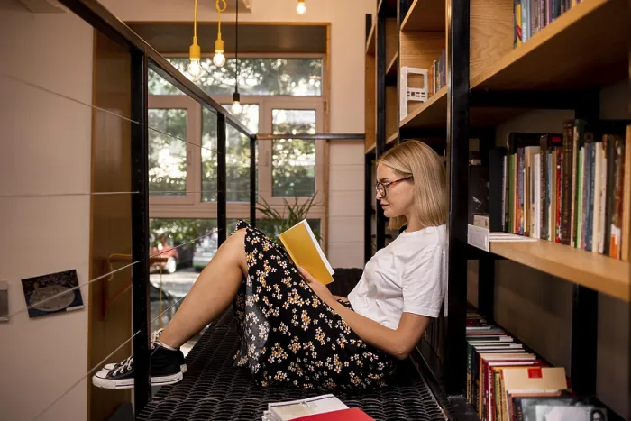 Framed Print : Student Reading in Library Print Framed Print : Student Reading in Library Print