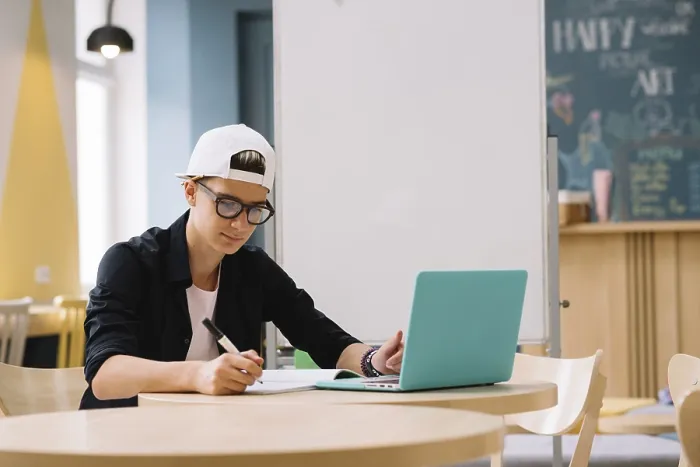 Framed Print : Student Working with Laptop Print Framed Print : Student Working with Laptop Print