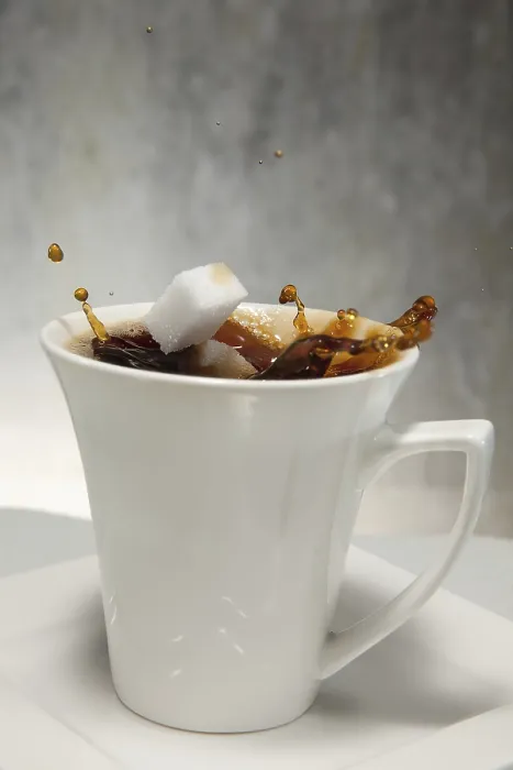 Framed Print : Two Sugar Cubes Falling into Coffee Print Framed Print : Two Sugar Cubes Falling into Coffee Print