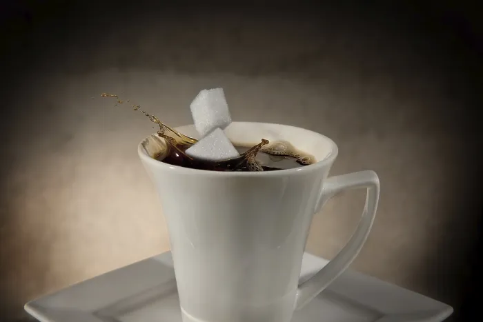 Framed Print : Two Sugar Cubes Falling into Coffee Print Framed Print : Two Sugar Cubes Falling into Coffee Print