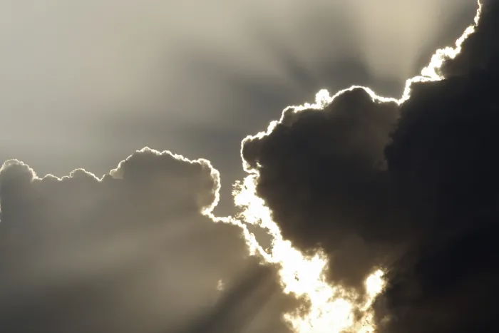 Framed Print : Sun behind storm clouds Print