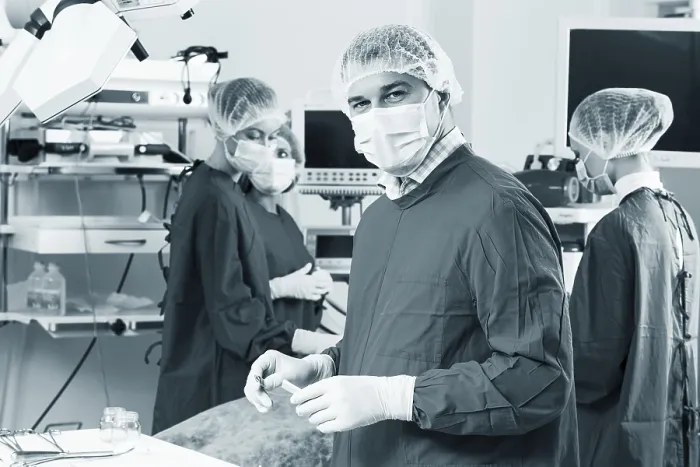 Framed Print : Surgeon Examining X-Ray with Colleagues - Print Framed Print : Surgeon Examining X-Ray with Colleagues - Print