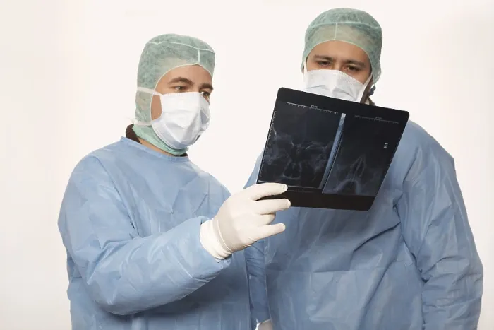 Framed Print : Two Surgeons Assessing an X-ray Print Framed Print : Two Surgeons Assessing an X-ray Print