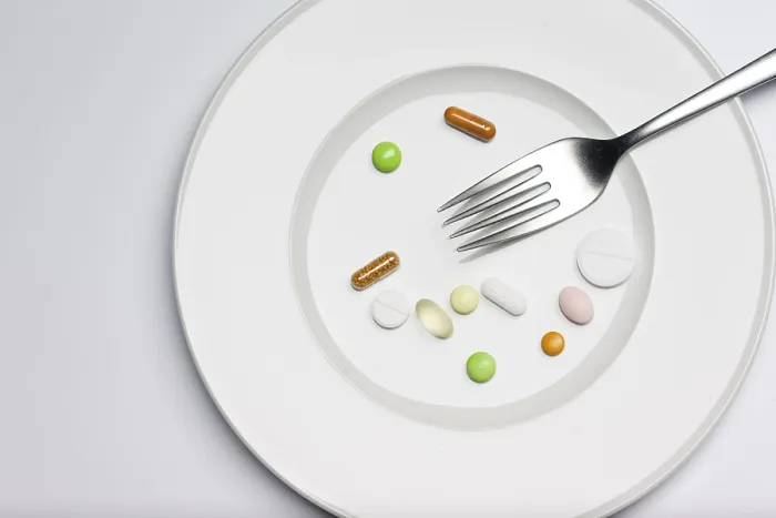 Framed Print : Tablets on a plate with a fork Print Framed Print : Tablets on a plate with a fork Print