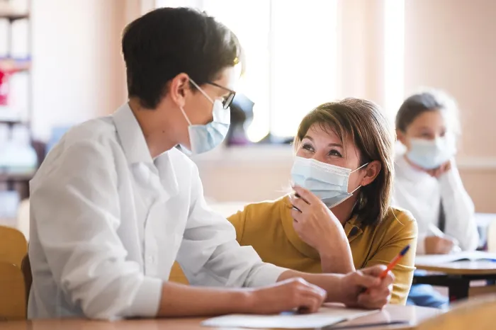 Framed Print : Teacher with Mask Explaining Class Print Framed Print : Teacher with Mask Explaining Class Print