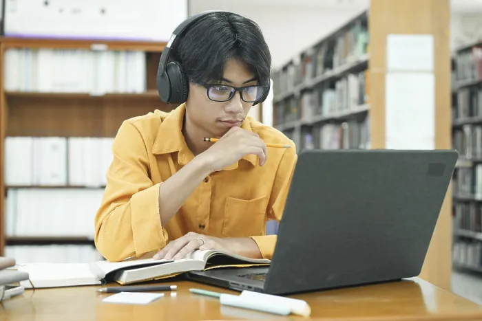 Framed Print : Print of a Young Student Preparing for Class Framed Print : Print of a Young Student Preparing for Class