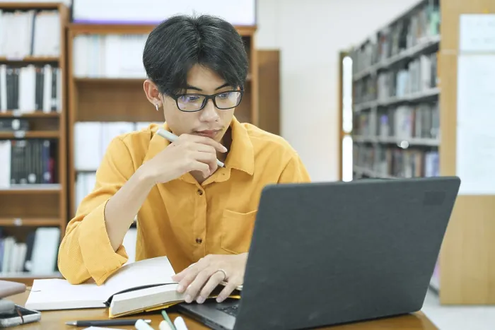 Framed Print : Print of a Young Student Preparing for Class Framed Print : Print of a Young Student Preparing for Class