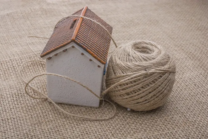 Framed Print : Thread Wrapped Model House Print on Brown Background Framed Print : Thread Wrapped Model House Print on Brown Background