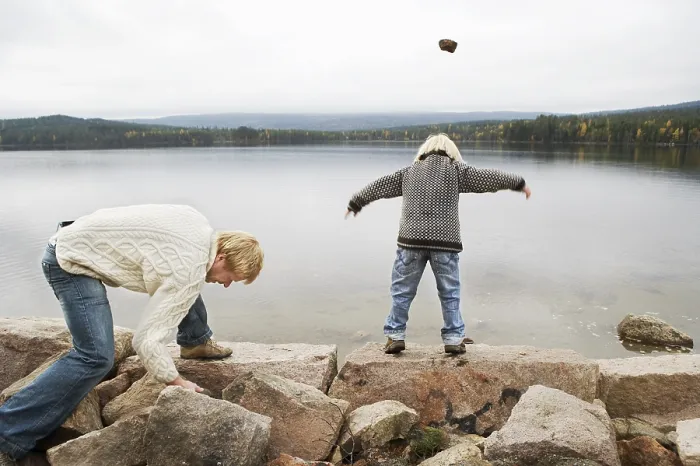 Framed Print : Throwing Stones Print by ImageBROKER Framed Print : Throwing Stones Print by ImageBROKER
