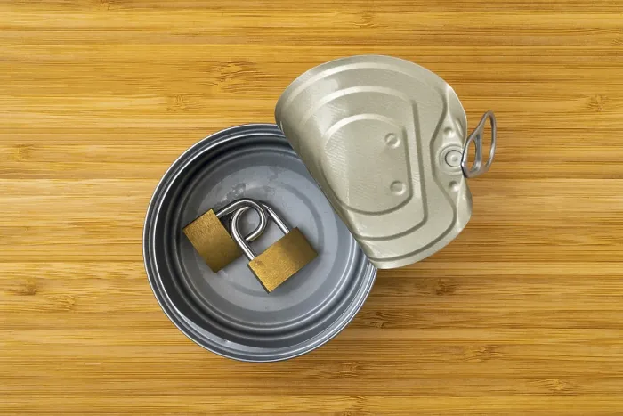 Framed Print : Tin Can with Linked Brass Padlocks Print - Security Concept Framed Print : Tin Can with Linked Brass Padlocks Print - Security Concept