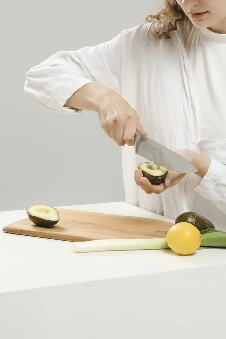 Framed Print : Unrecognizable Woman Removes Avocado Pit Print Framed Print : Unrecognizable Woman Removes Avocado Pit Print
