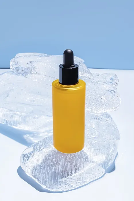 Framed Print : Vibrant Yellow Serum Bottle on Ice Print Framed Print : Vibrant Yellow Serum Bottle on Ice Print