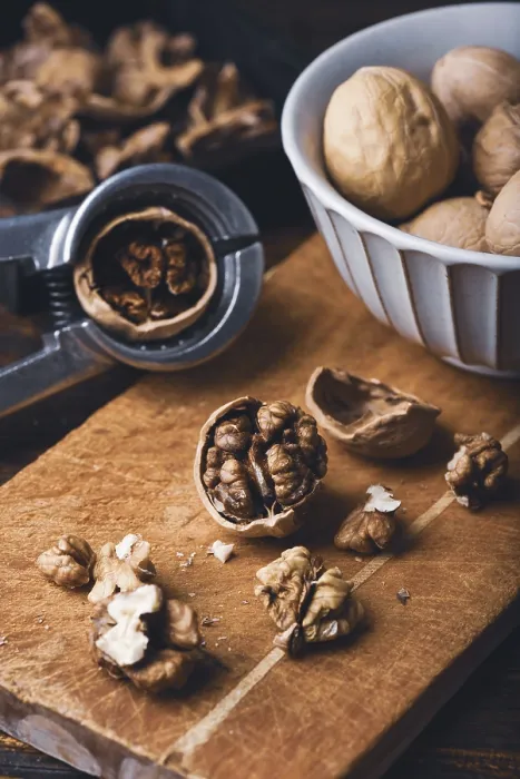 Framed Print : Walnuts and Nutcracker Print on Wooden Surface Framed Print : Walnuts and Nutcracker Print on Wooden Surface