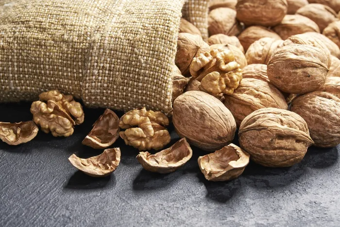Framed Print : Walnuts Spilled on Black Table Print Framed Print : Walnuts Spilled on Black Table Print