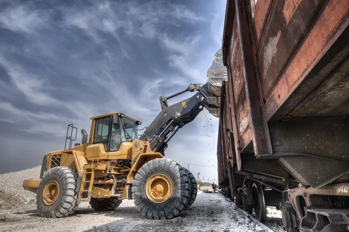 Framed Print : Wheel Loader Excavator with Backhoe Unloading Clay Print Framed Print : Wheel Loader Excavator with Backhoe Unloading Clay Print