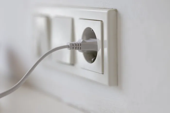 Framed Print : White Power Plug in Socket Print, Cologne, Germany