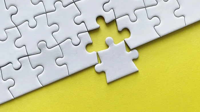 Framed Print : White Puzzle Print with Missing Piece on Yellow Background Framed Print : White Puzzle Print with Missing Piece on Yellow Background
