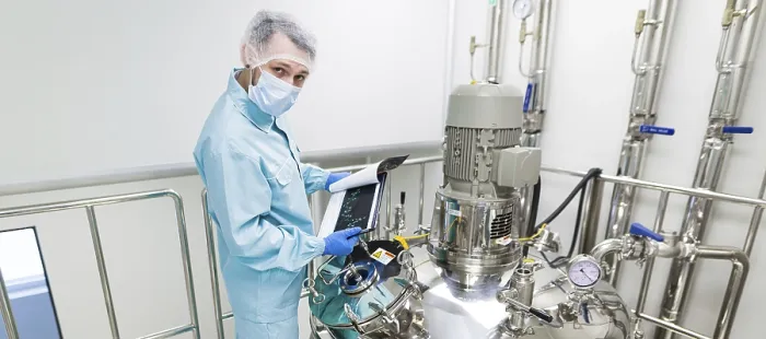 Framed Print : Widescreen Print: Scientist in Clean Room Checking Graphs Framed Print : Widescreen Print: Scientist in Clean Room Checking Graphs